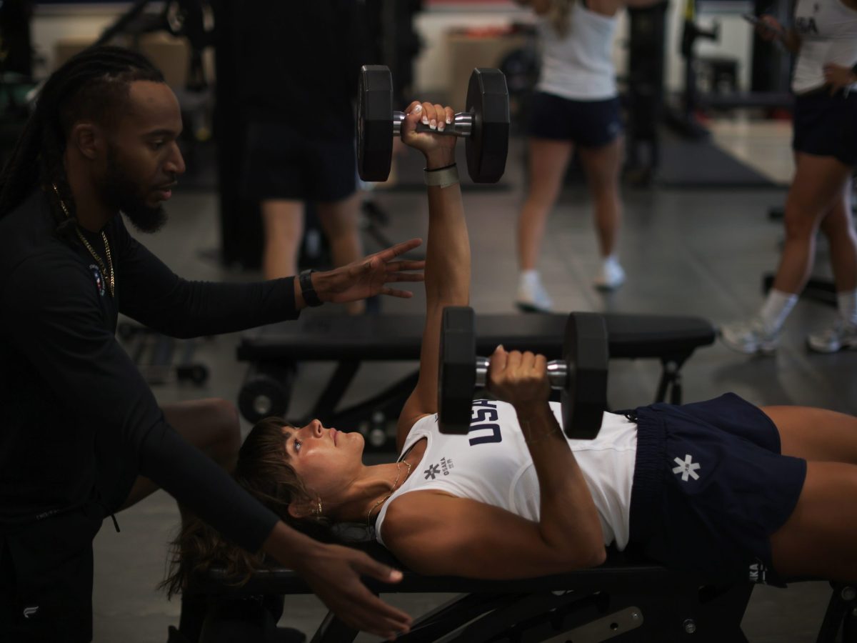 woman lifts weights