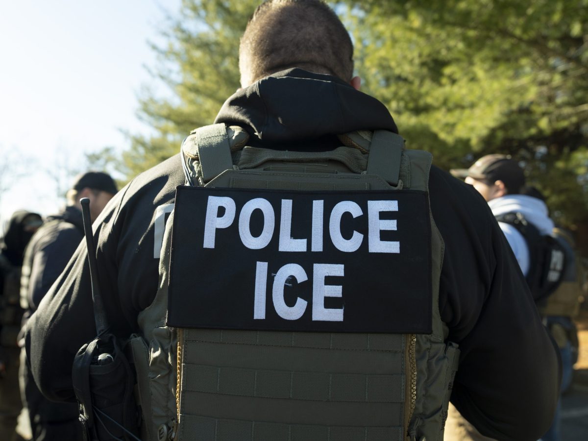 Man with ICE jacket